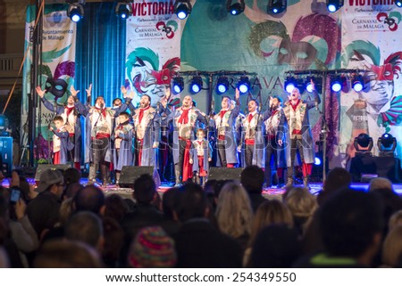 Malaga, Spain - Feb 14, 2015: Unidentified Carnival group singing in costumes in the carnival show in Malaga, Spain on February 14, 2015