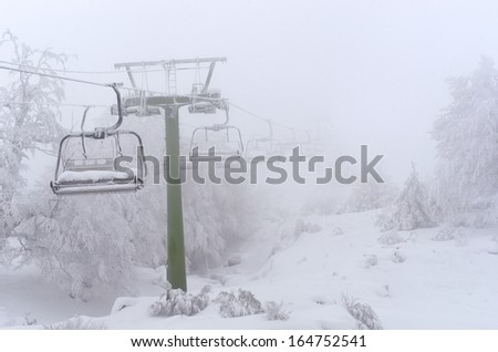 A chairlift frozen out of service.