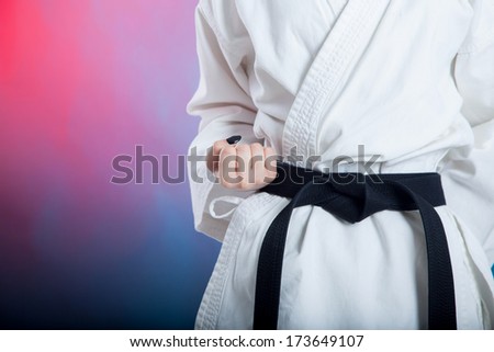 karate girl with black belt posing