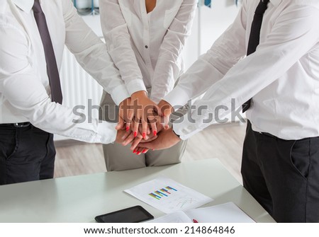 Team work concept. Business people joining hands.