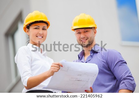 Construction manager and engineer woman working on building site