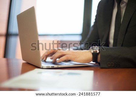 people hands typing on laptop keyboard