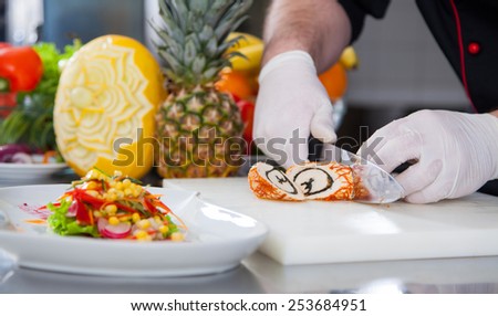 mature chef preparing a meal with various fruits and vegetables