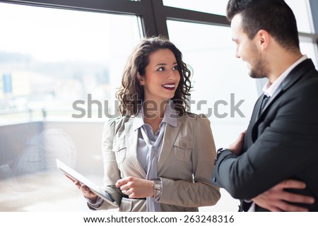 businessman and woman discussing with table  in office