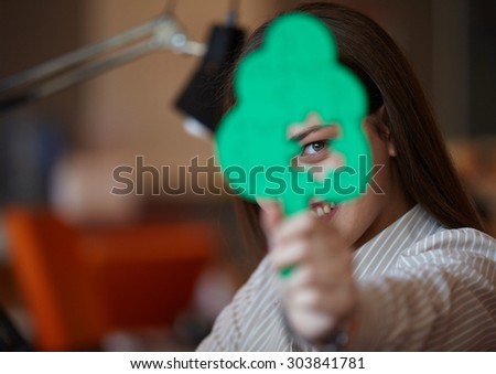 business woman with tree puzzle looking happy and smiling