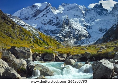 This is snow summits in Caucasus mountains in autumn
