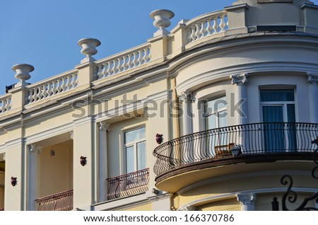 Beautiful element of the house with a balcony and windows