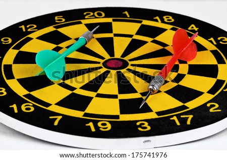 Darts and arrows on a white background closeup