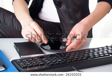 The beautiful girl behind a desktop