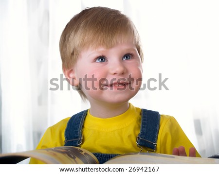 The child with books on the white background