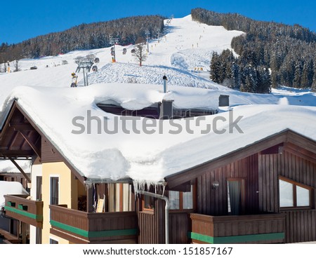 Austrian chalet over ski slopes in Saalbach