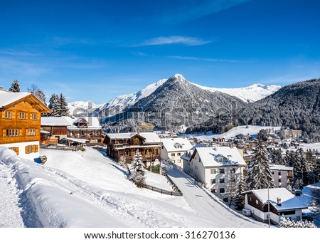 Wood chalet  over scenery of winter  resort Davos, Switzerland.