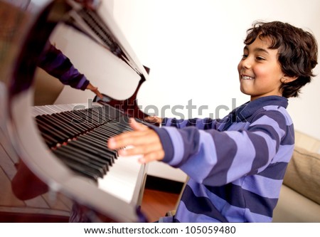 Similar – Image, Stock Photo Smiling child playing piano in cozy room in daylight