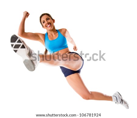 Female athlete jumping - isolated over a white background