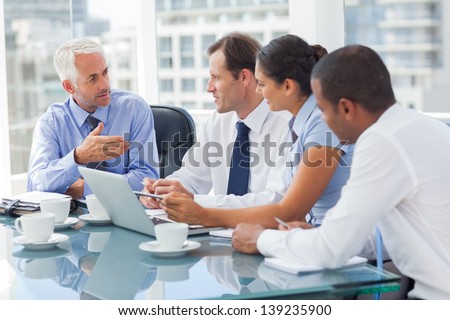 Group of business people brainstorming together in the meeting room