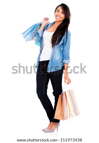 Happy female shopper holding shopping bags - isolated over white 