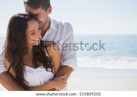 Similar – Image, Stock Photo Affectionate young couple hugging on beach