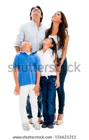 Happy family looking up - isolated over a white background 