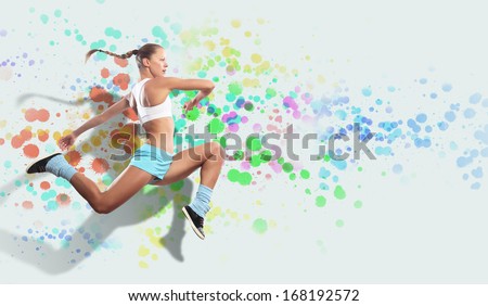 Image of sport girl in jump against color spot background