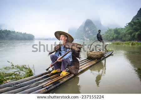 Traditional Chinese cormorant fisherman on the Li River in Yangshuo, China.