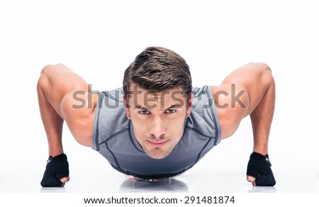 Sports young man doing push ups isolated on a white background