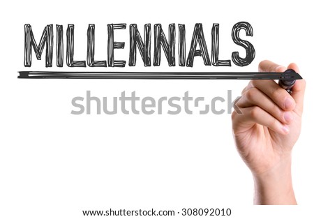 Hand with marker writing the word Millennials