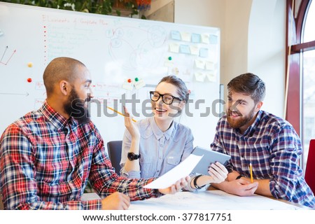 Multiethnic group of happy business people working together in office