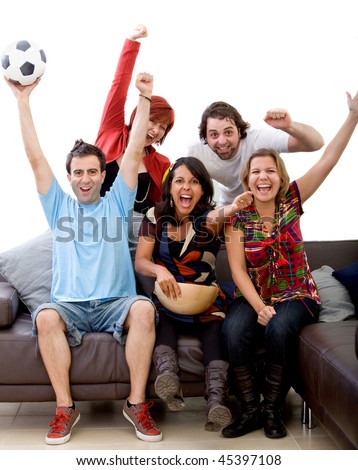 Excited group of people watching football at home