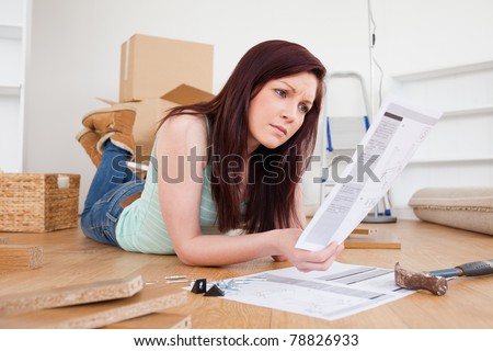 Similar – Image, Stock Photo Woman reading manual instruction to assemble furniture