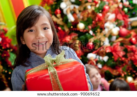 Similar – Image, Stock Photo Young woman in christmassy clothes looks smiling at a christmas present