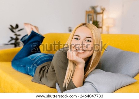 Image, Stock Photo Teenage girl lying in a blue armchair