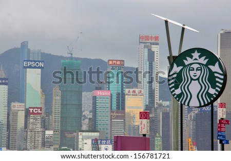 HONG KONG, CHINA - JUNE 10: Starbucks coffee logo and skyscrapers on Avenue of Stars on June 10, 2012. Starbucks has more than 30 cafes in Hong Kong.