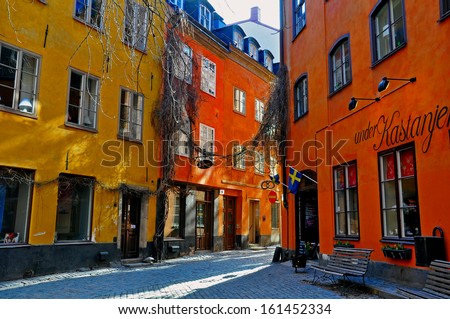 STOCKHOLM, SWEDEN - MARCH 16: Sunlight on the street with multicolor houses in downtown on March 16, 2013. Stockholm is the most populous city in Sweden and on the Scandinavian peninsula.