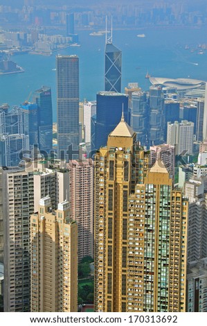 HONG KONG, CHINA - JUNE 6: Modern buildings of Hong Kong downtown from Victoria Peak on June 6, 2012. Hong Kong is one of the two Special Administrative Regions of the People\'s Republic of China.