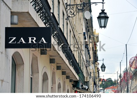 LISBON, PORTUGAL - DEC 25, 2013: Zara store sign on the grey building on Agusta street on December 25, 2013. Lisbon is the largest city and capital of Portugal.