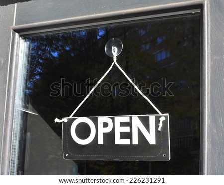 Open sign hanging on the door