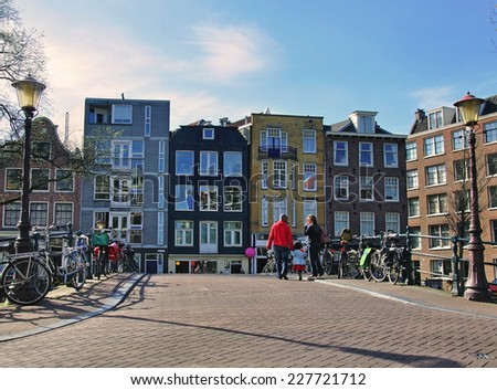 AMSTERDAM, NETHERLANDS - MARCH 26: Houses on the street of Amsterdam city center on March 26, 2012. Amsterdam is the capital and most populous city of the Netherlands.