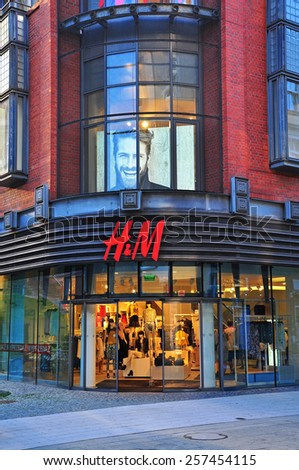 POZNAN, POLAND - AUGUST 2: Facade of H&M flagship store in Poznan downtown on August 2, 2014. H&M is a Swedish multinational clothing company, known for its fast-fashion clothing.