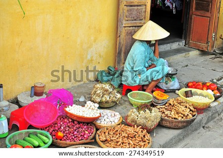 HOI AN, VIETNAM - MARCH 12: Woman at the food market in Hoi An old town, Vietnam on March 12, 2015. Hoi An is a city of Vietnam, on the coast of the East Sea.