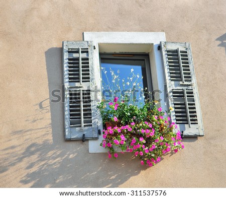 Window with flowers in the french house