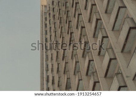 Similar – Foto Bild Verlassenes Gebäude gegen sauberen Himmel. Sowjetische modernistische Architektur, notleidende Betonhaus