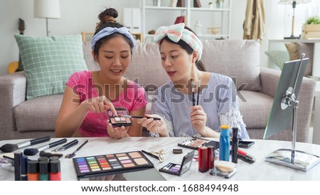 Similar – Image, Stock Photo Two beautiful sisters do their homework during quarantine. Children use gadgets for learning. Education, distance learning, home schooling during quarantine