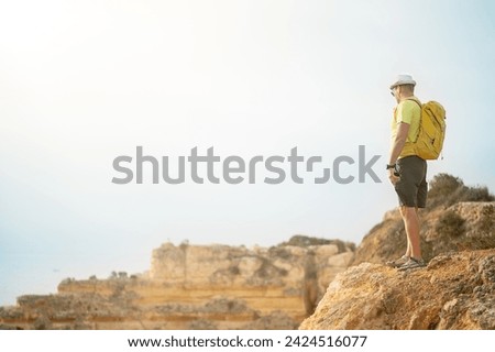 Similar – Image, Stock Photo Unrecognizable man on cliff near sea