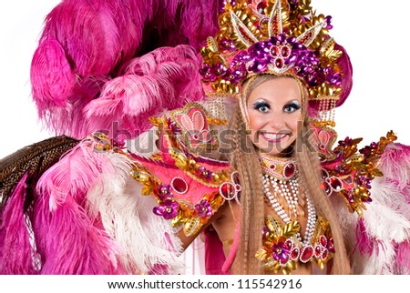 Portrait of young woman in pink carnival costume, close up against white background