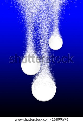 Tablets fizzing in blue water, close up