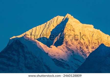 Similar – Image, Stock Photo Snowy mountains lit by sunlight light in evening