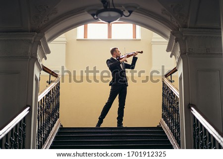 Similar – Image, Stock Photo Man playing violin with face mask