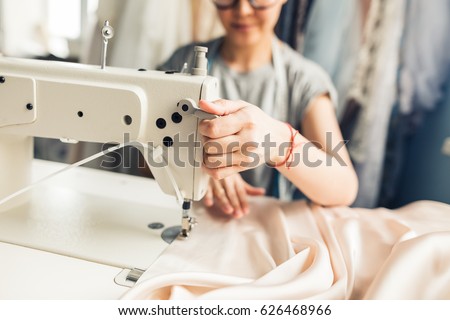 Similar – Foto Bild Schneiderin beim Nähen an der Maschine im Atelier