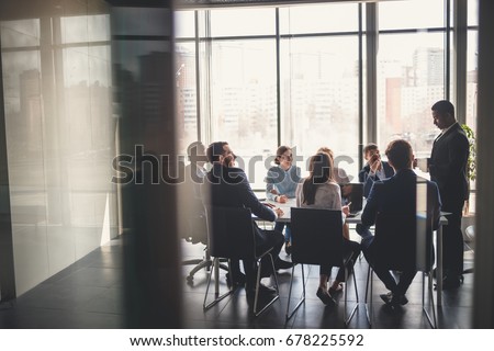 Photo of Business people working in conference room