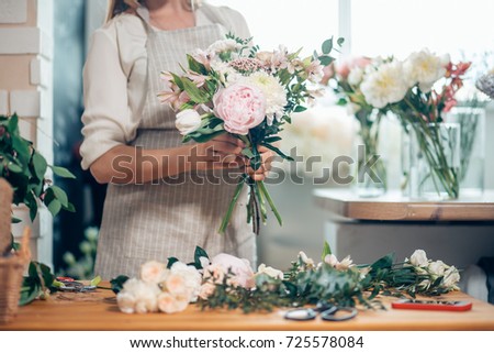 Similar – Image, Stock Photo Female designer creating floral bouquets in studio